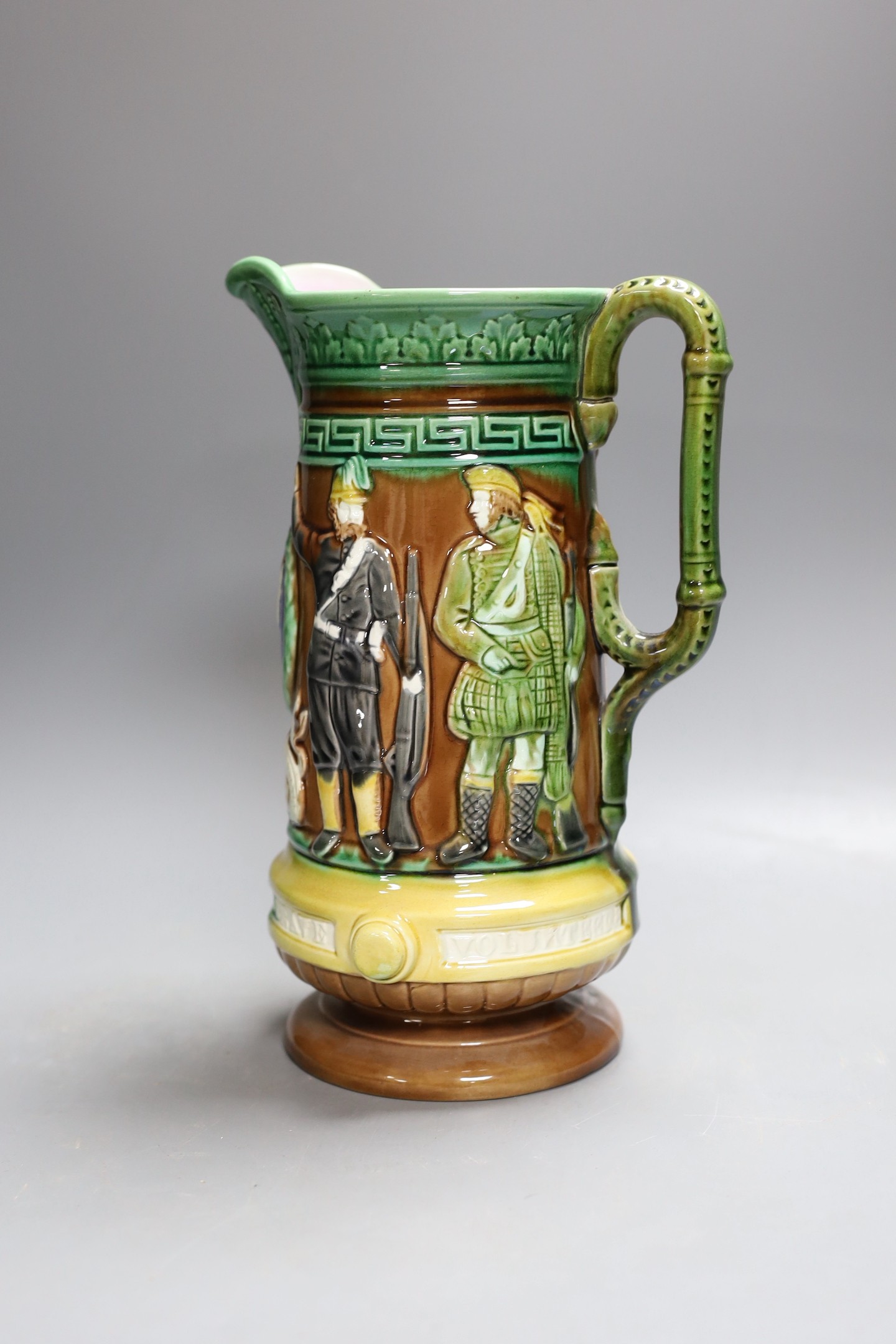 A Victorian Majolica military volunteers commemorative jug - 27cm tall